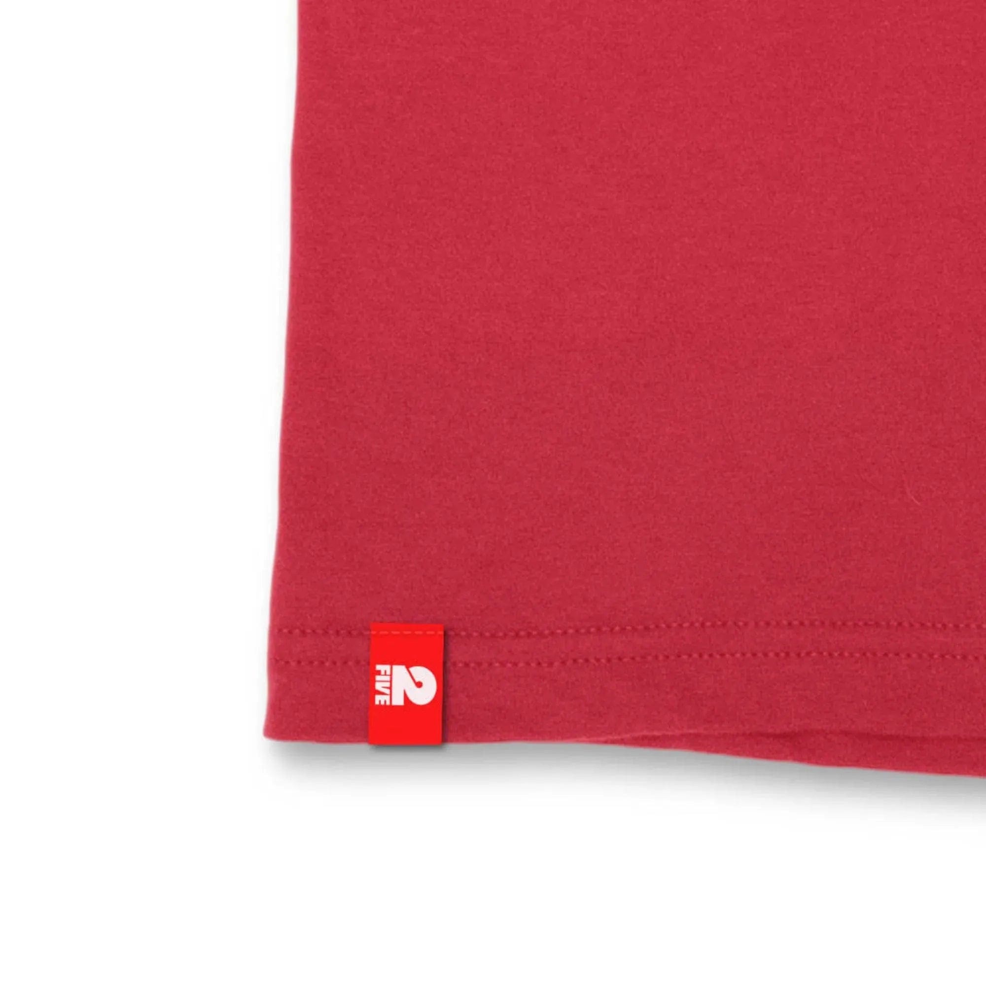 Close detail of the red FIVE2 Slash Tee fabric and FIVE2 hem label