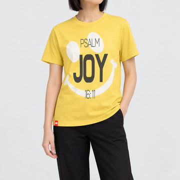 FIVE2 Joy Tee in Yellow, front model view with a white smile graphic, charcoal Joy lettering and Psalm 16:11.