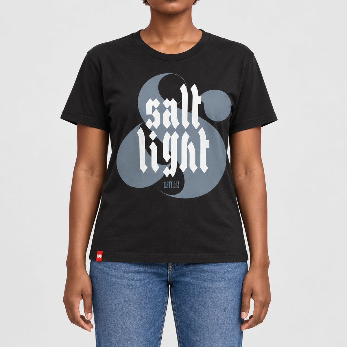 FIVE2 Salt and Light Tee in black, front model view with white gothic salt and light lettering over a gray ampersand and Matthew 5:13.